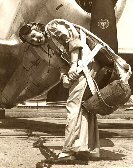 WASP Deanie Bishop Parrish strapping on her parachute.
